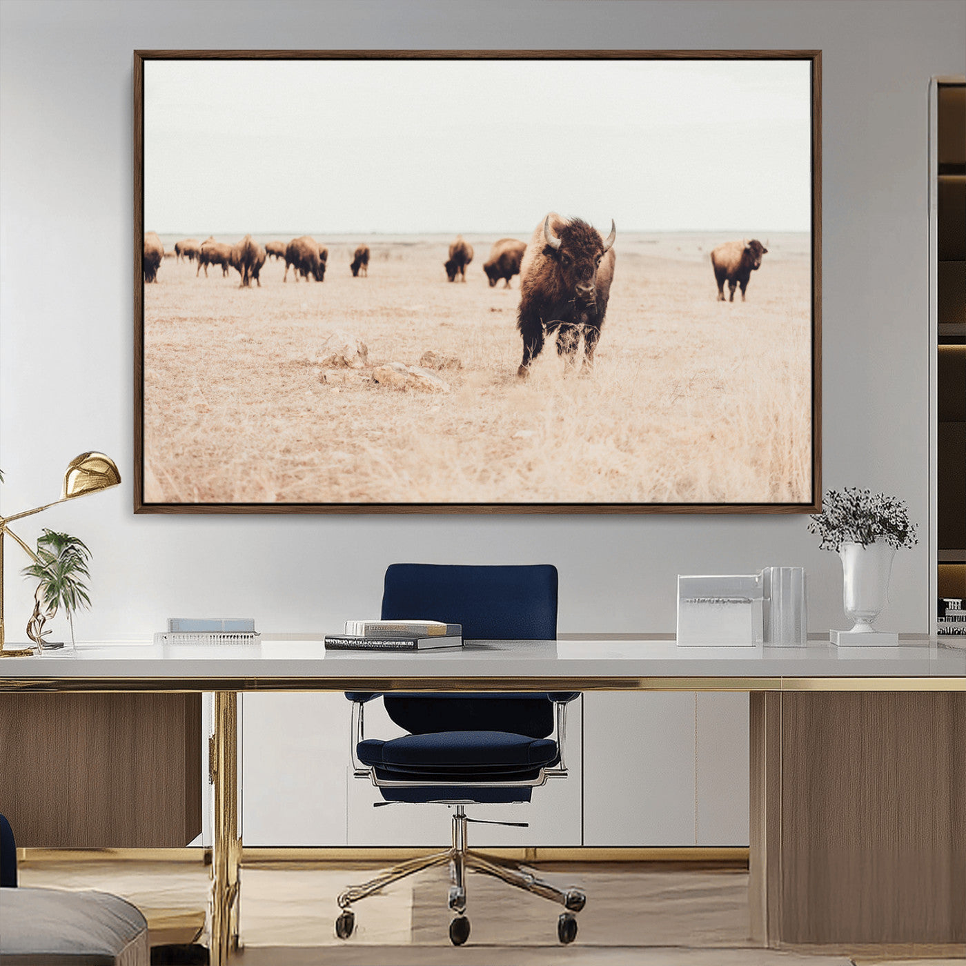 Herd of bison roaming a vast prairie with golden grass under a soft sky, creating a rustic and Western landscape, ideal for wall art.