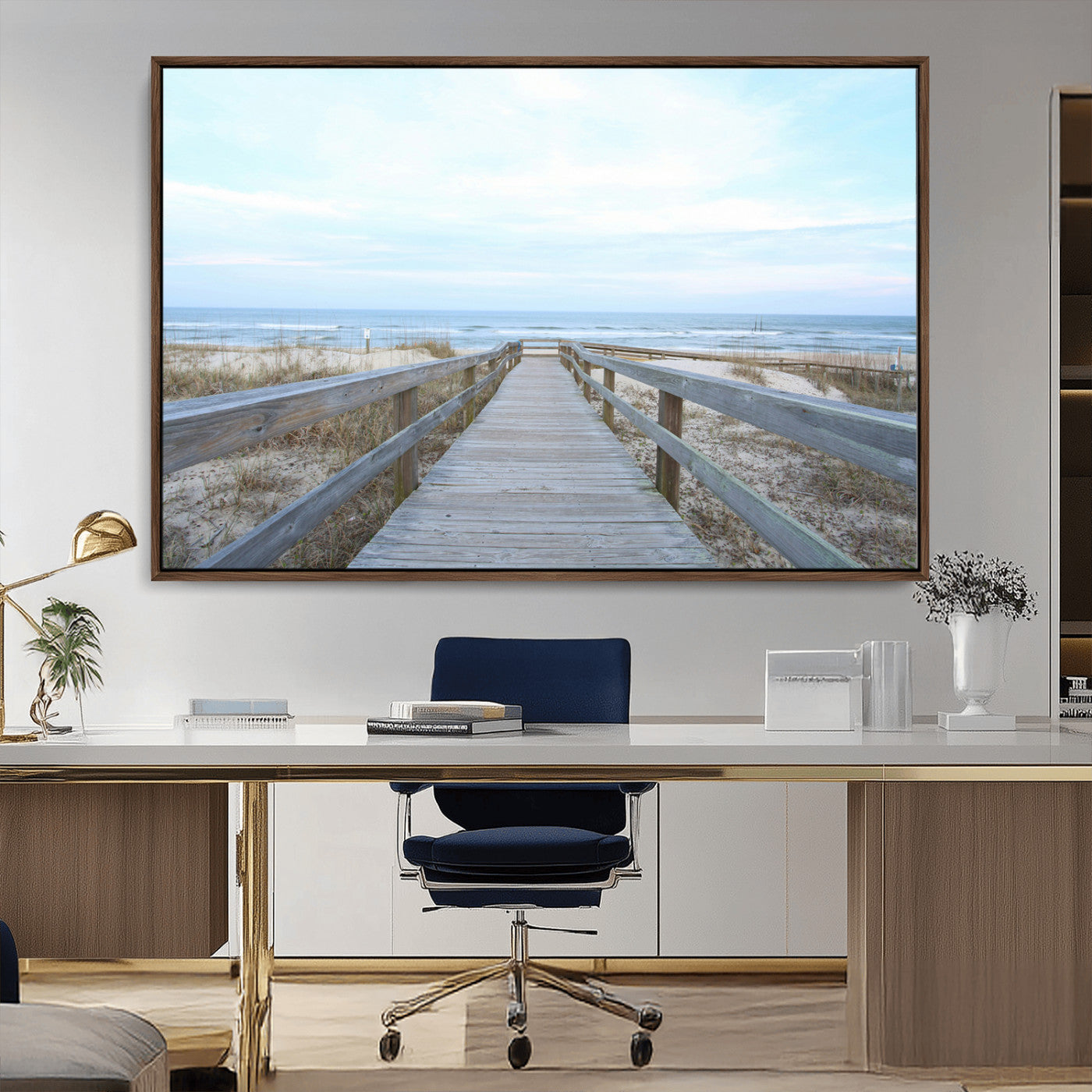 Wooden boardwalk leading to a peaceful beach with gentle ocean waves under a soft pastel sky, perfect for coastal and nautical home decor.