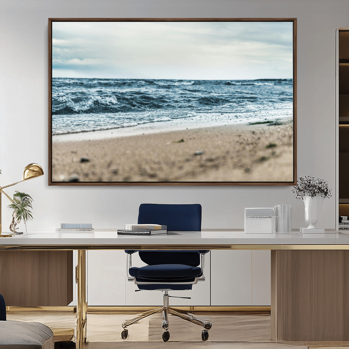 A moody ocean scene with gentle waves washing onto a sandy beach under a cloudy sky, creating a peaceful and coastal atmosphere.