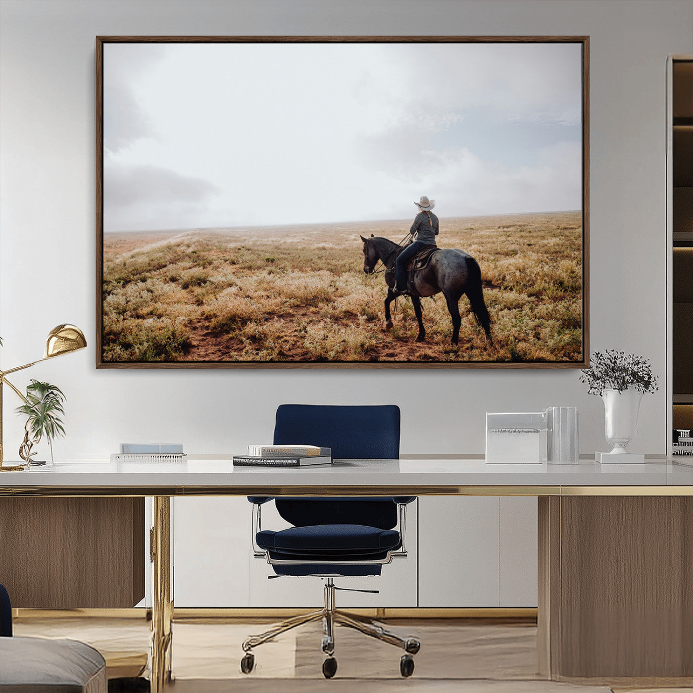 A lone cowboy riding horseback across an open prairie under a vast sky, capturing the rugged and timeless spirit of the Western frontier.