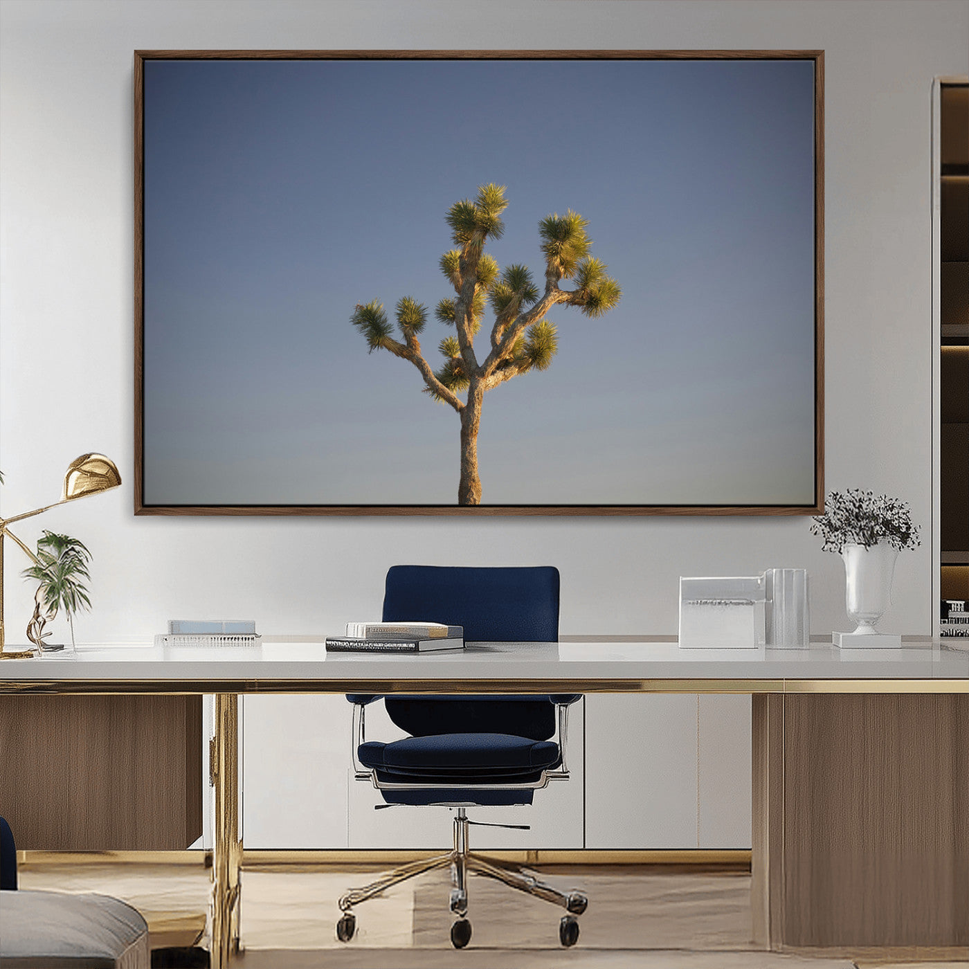 A lone Joshua Tree standing against a deep blue sky, capturing the serene and rugged beauty of the Southwestern desert landscape.