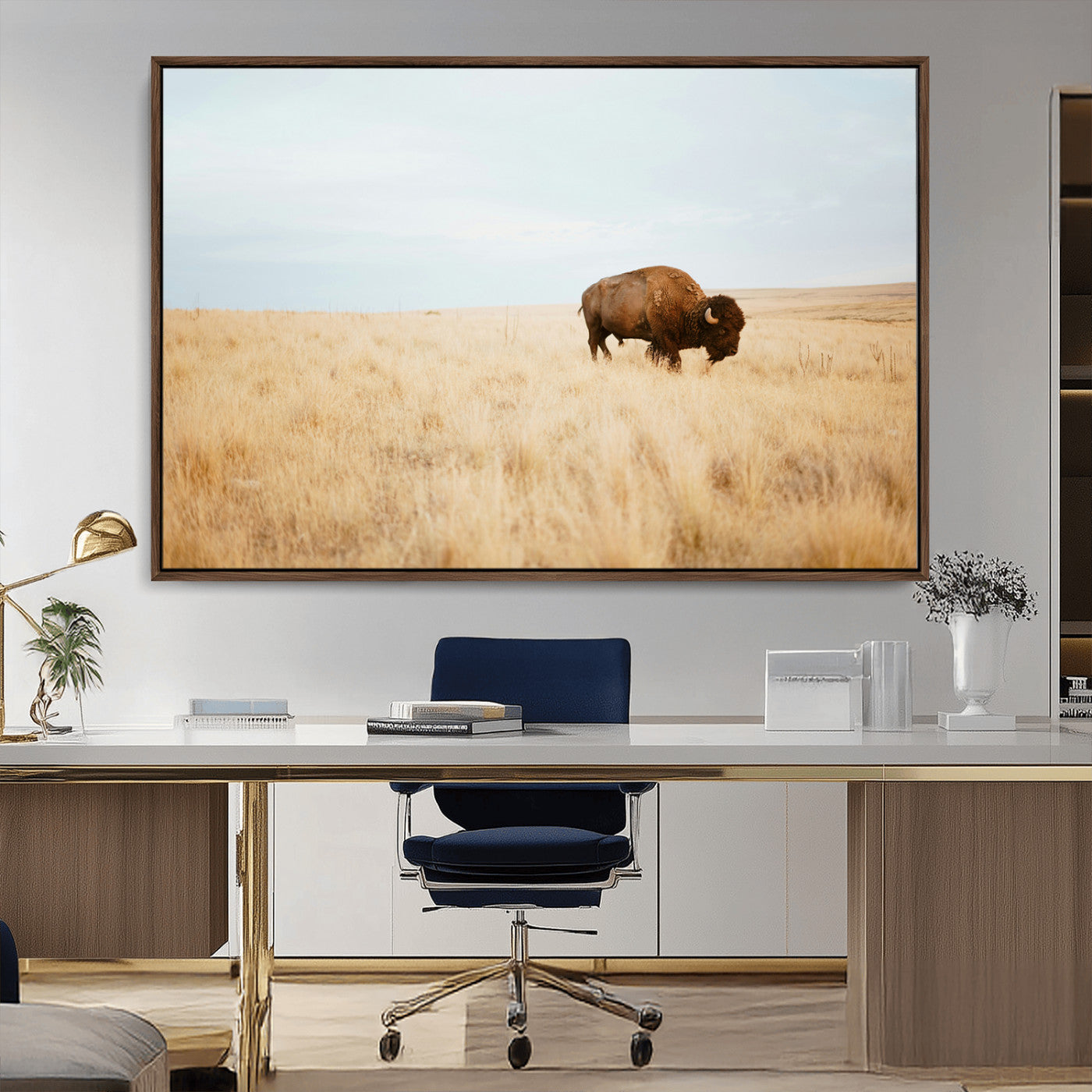 A lone bison standing in a vast golden grassland under a soft blue sky, evoking a rustic and Western aesthetic, ideal for farmhouse decor.