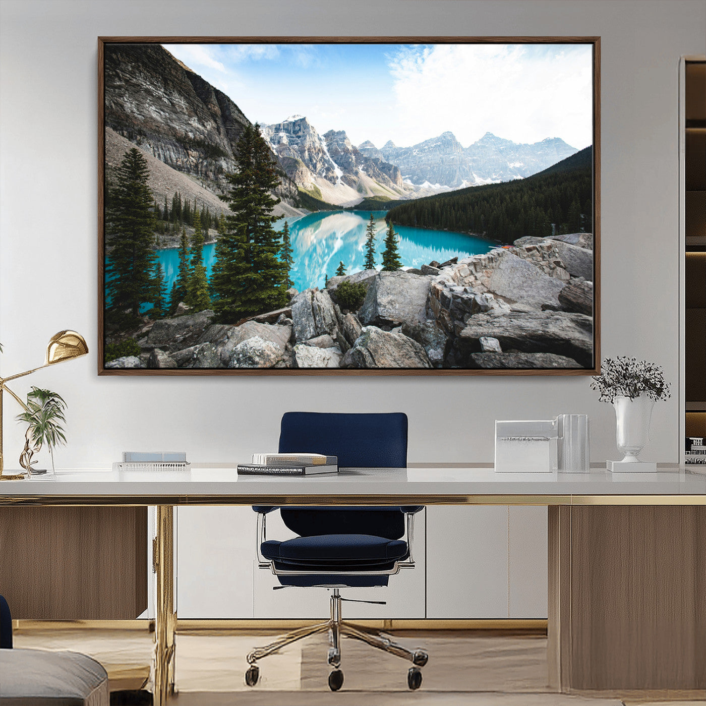 Stunning view of Moraine Lake with turquoise waters reflecting snow-capped mountains and evergreen trees, creating a peaceful alpine decor.