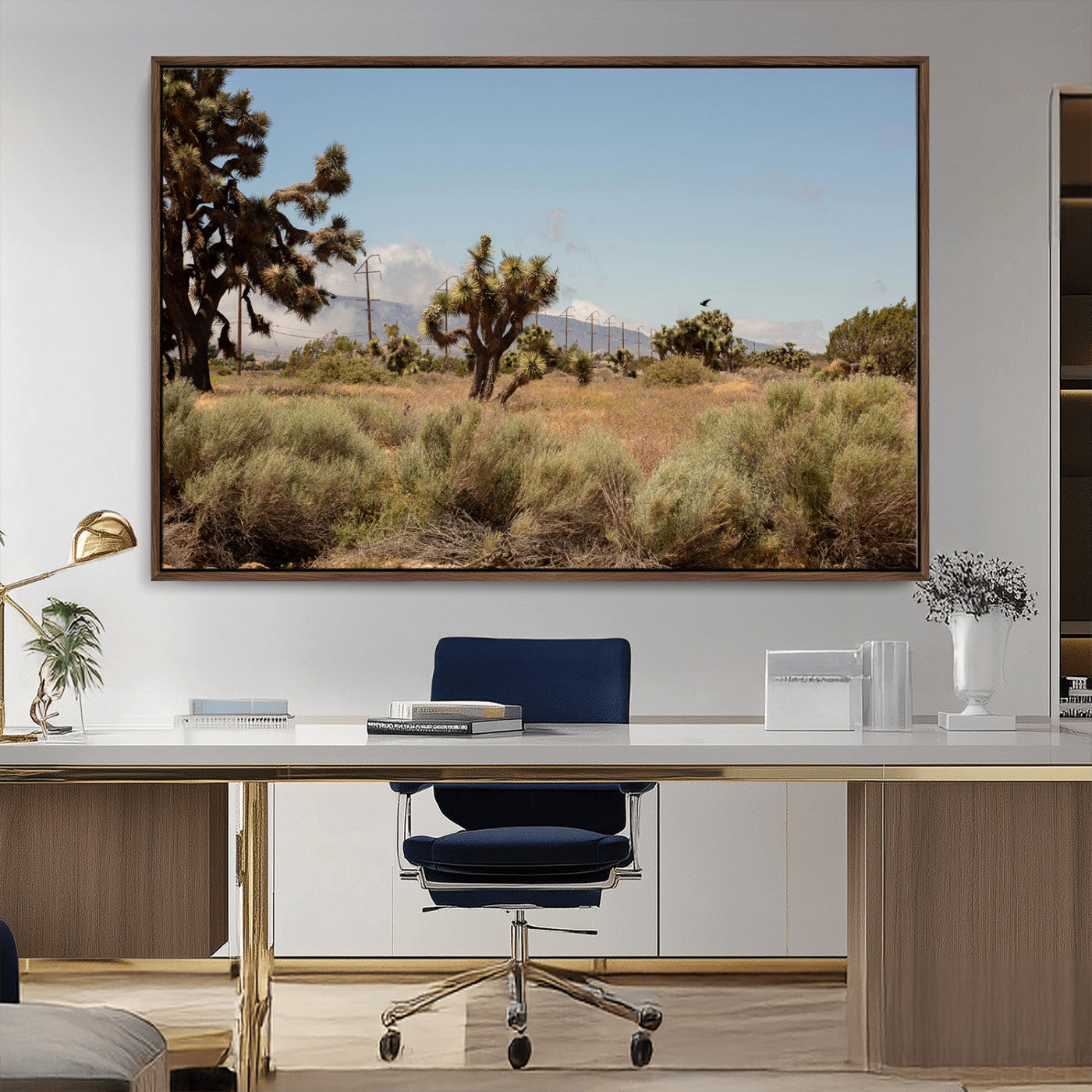 Scenic desert landscape with Joshua trees, dry grass, and distant mountains under a clear blue sky, perfect for southwestern and rustic decor.