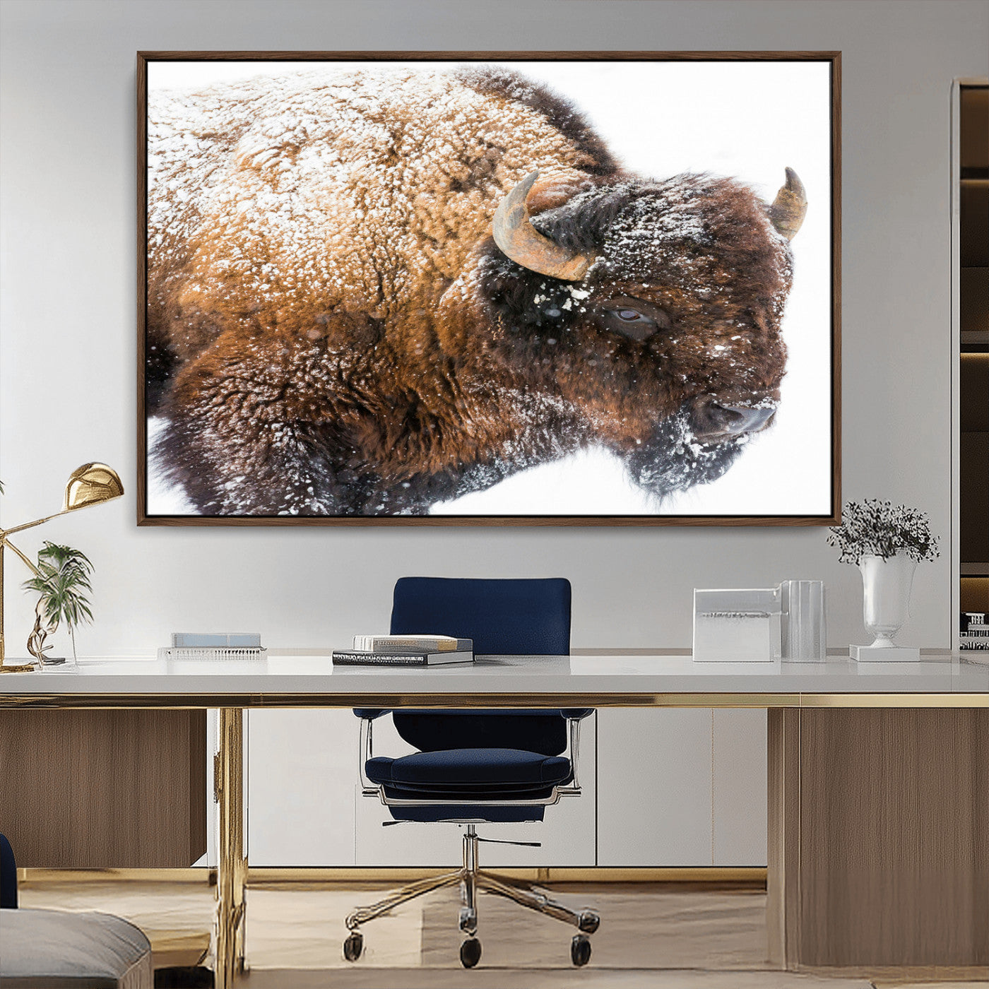 Close-up photograph of a bison covered in snow, highlighting its thick fur and powerful presence, set against a white winter backdrop, ideal for rustic decor.