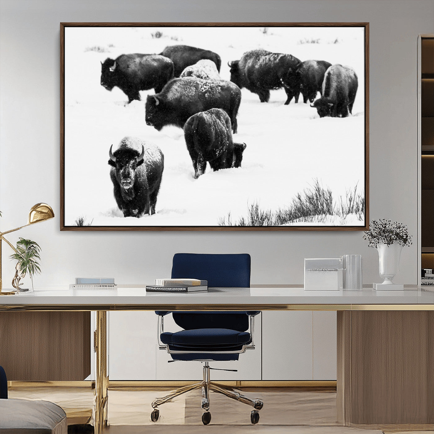 Black and white photograph of a bison herd in a snowy landscape, with snow-covered fur and a rugged wilderness setting, perfect for rustic lodge decor.