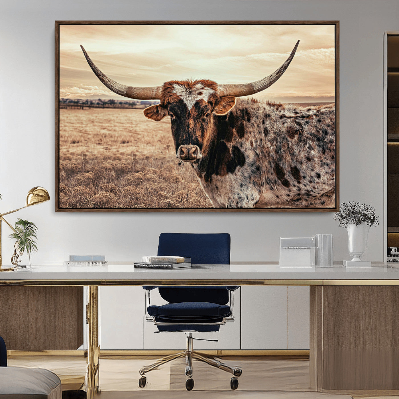 Close-up of a longhorn cow with distinctive curved horns standing in a dry grass field under a cloudy sky.