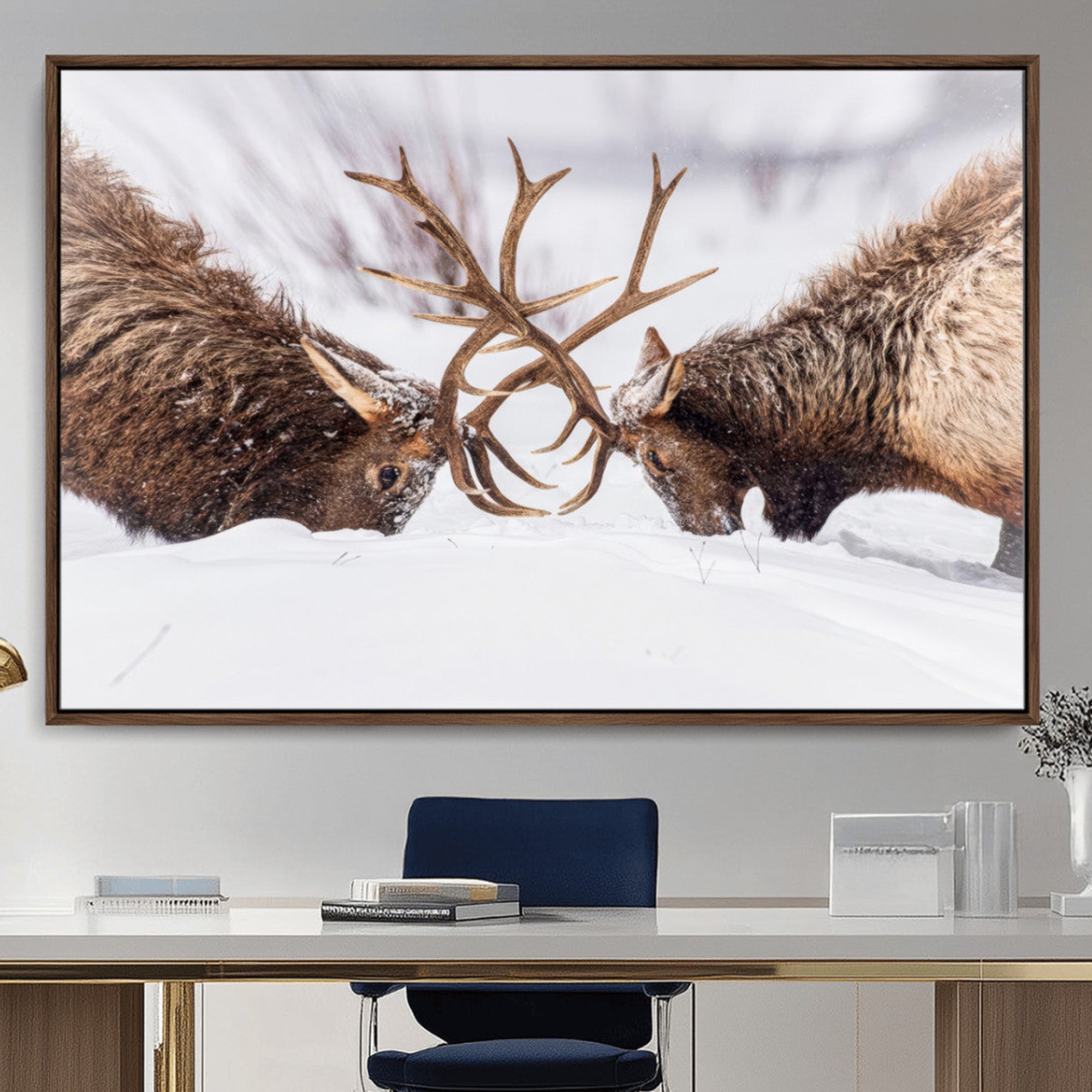 A dramatic wall art canvas print showcasing two majestic elk locking antlers in a snowy winter landscape, capturing the raw power and beauty of wildlife, ideal for nature-inspired home decor.