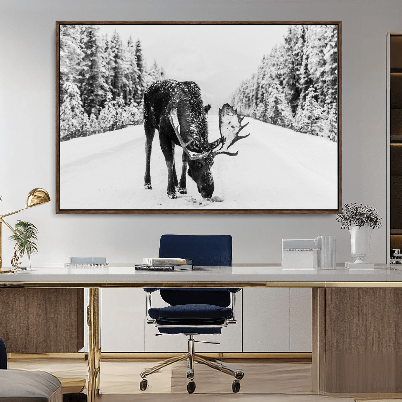 A majestic moose grazing in the snow-covered wilderness, surrounded by snow-covered trees, creating a peaceful winter scene.
