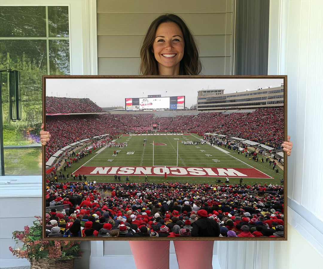 The wall art depicts WISCONSIN in red and white, similar to Wisconsin Badgers Football Canvas Art.