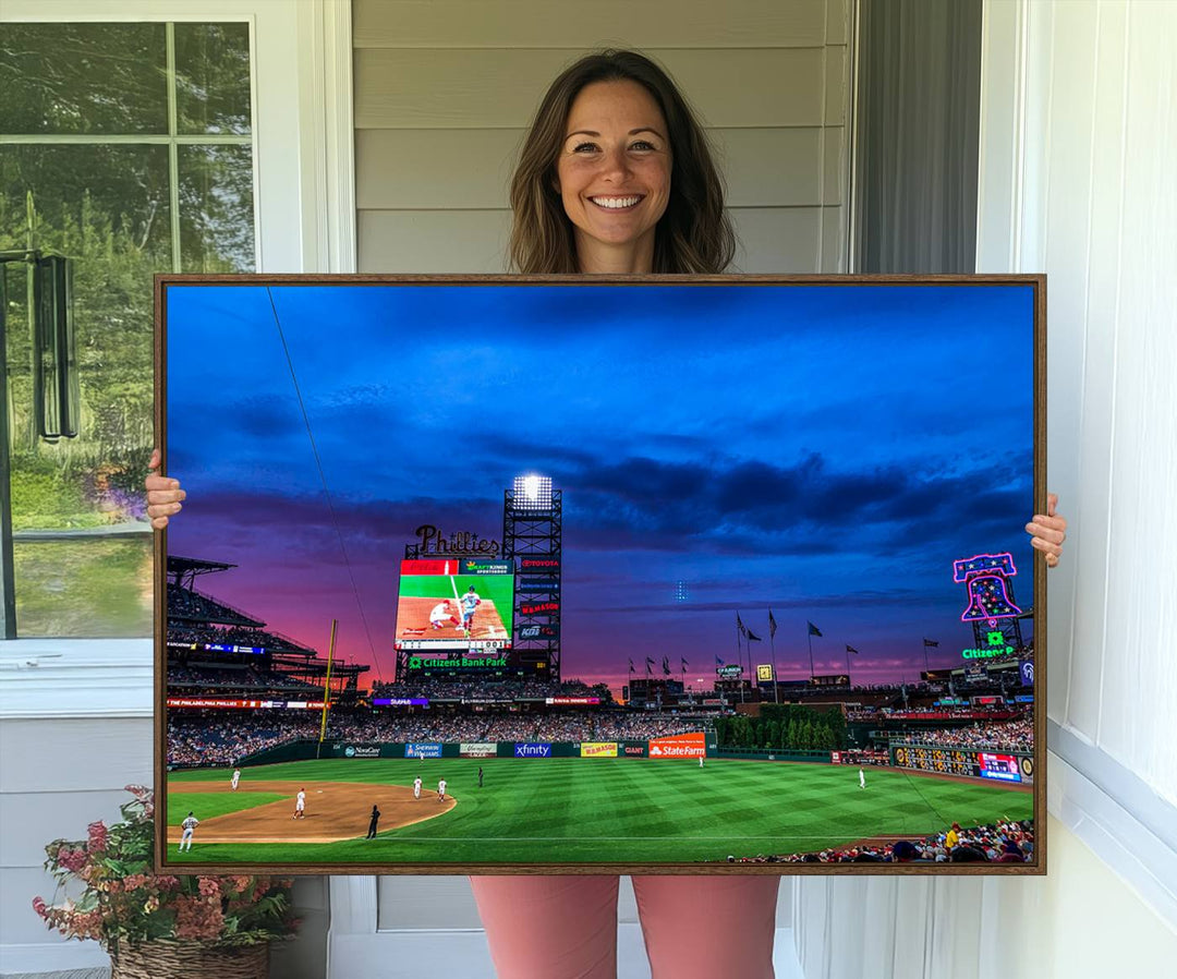 The Phillies canvas print captures a stunning sunset, vibrant signage, and players on the field.