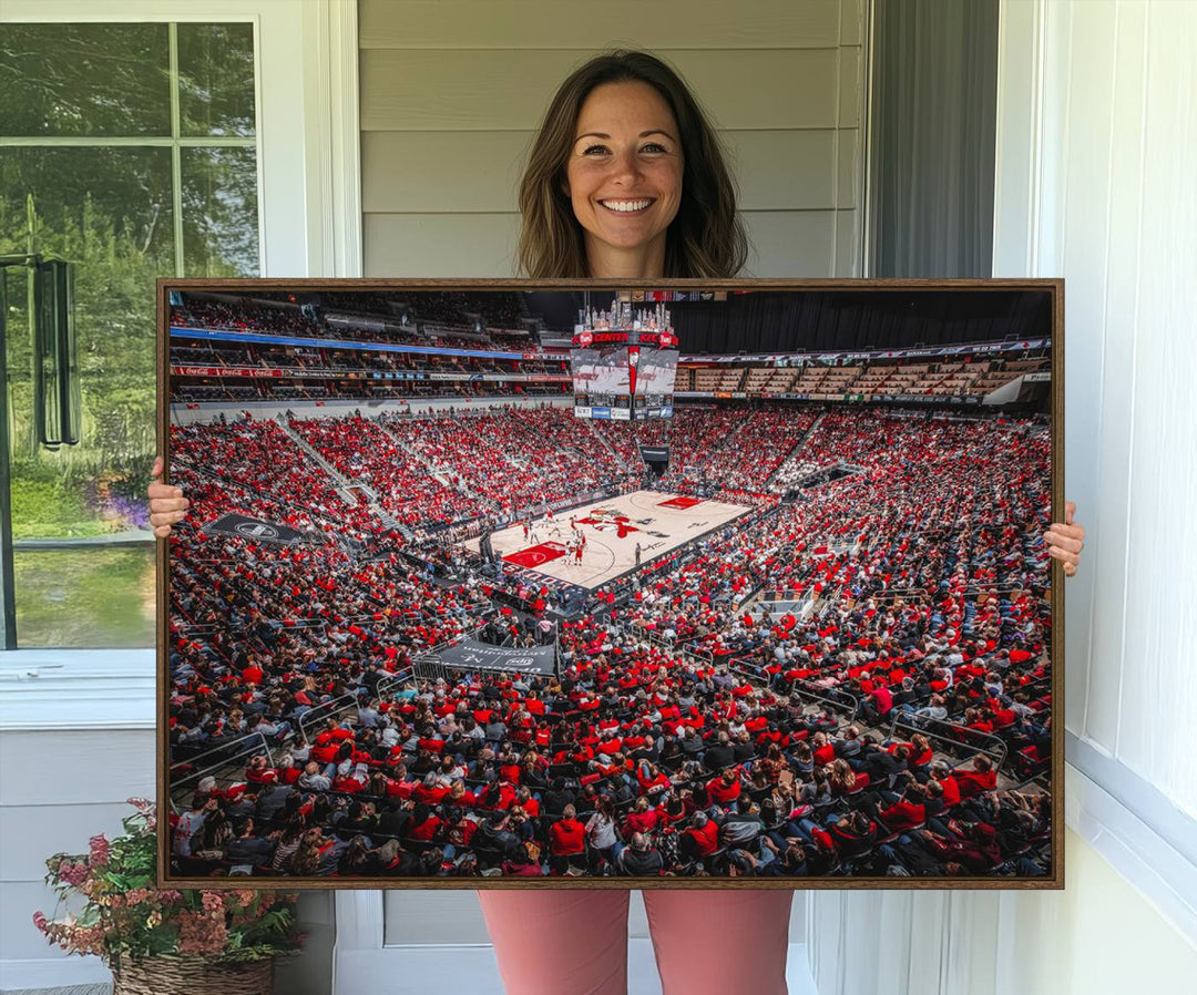 A painting of Louisville Cardinals fans in red at the KFC Yum Center Arena.