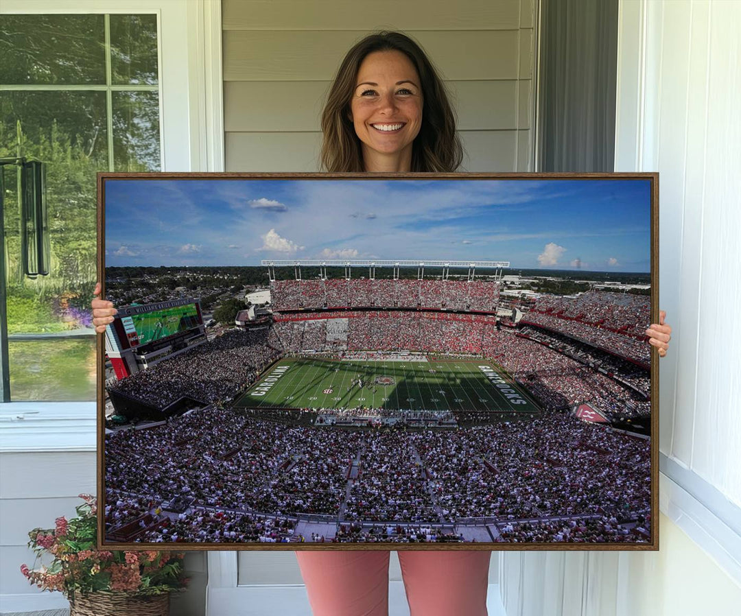 The wall art is a South Carolina Gamecocks print, showcasing Williams-Brice Stadium from a distance under clear skies.