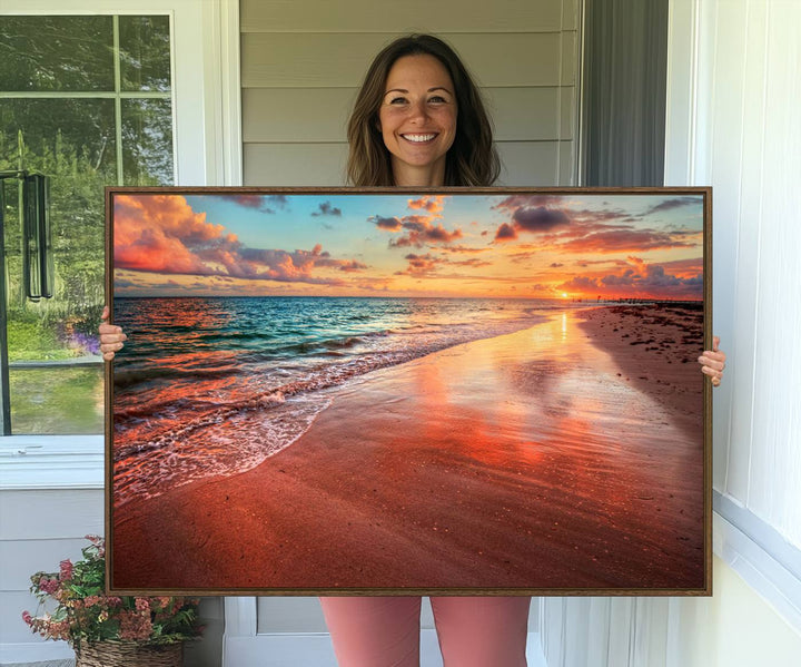 An Ocean Canvas Print depicts a sunset over a beach with reflections.