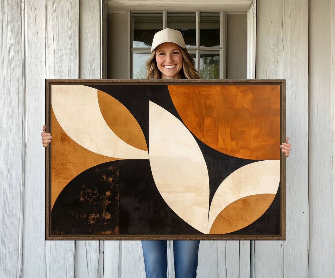 Geometric abstract wall art print featuring leaf shapes in brown, beige, and black.