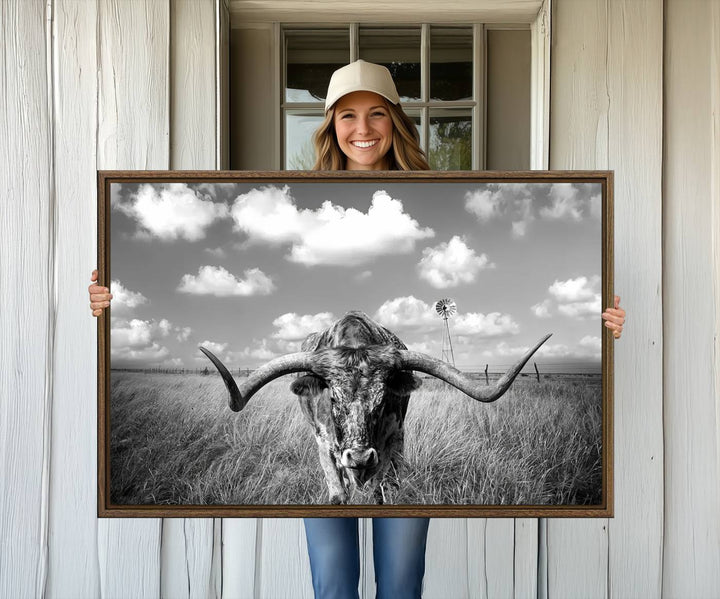 Longhorn Cow Field Canvas Print featuring rustic charm with a windmill backdrop.