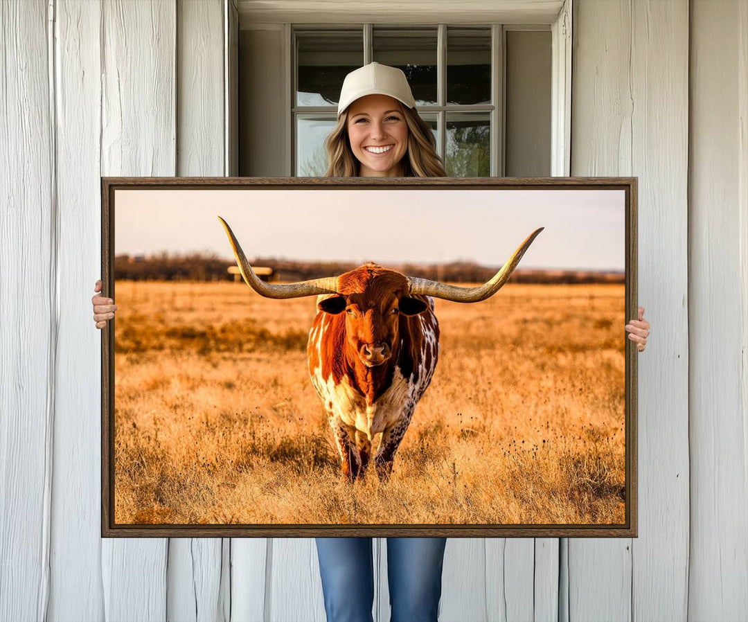 The Longhorn Cow Wall Art framed canvas brings rustic charm and farmhouse decor with its warm field scene.