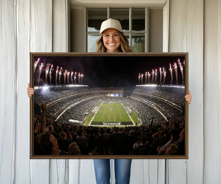 The wall art of Eagles Field Stadium showcases nighttime fireworks over a full stadium.