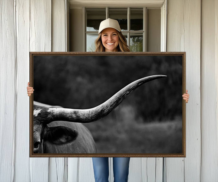 Cow Longhorn Wall Art: This black and white print adds rustic charm.