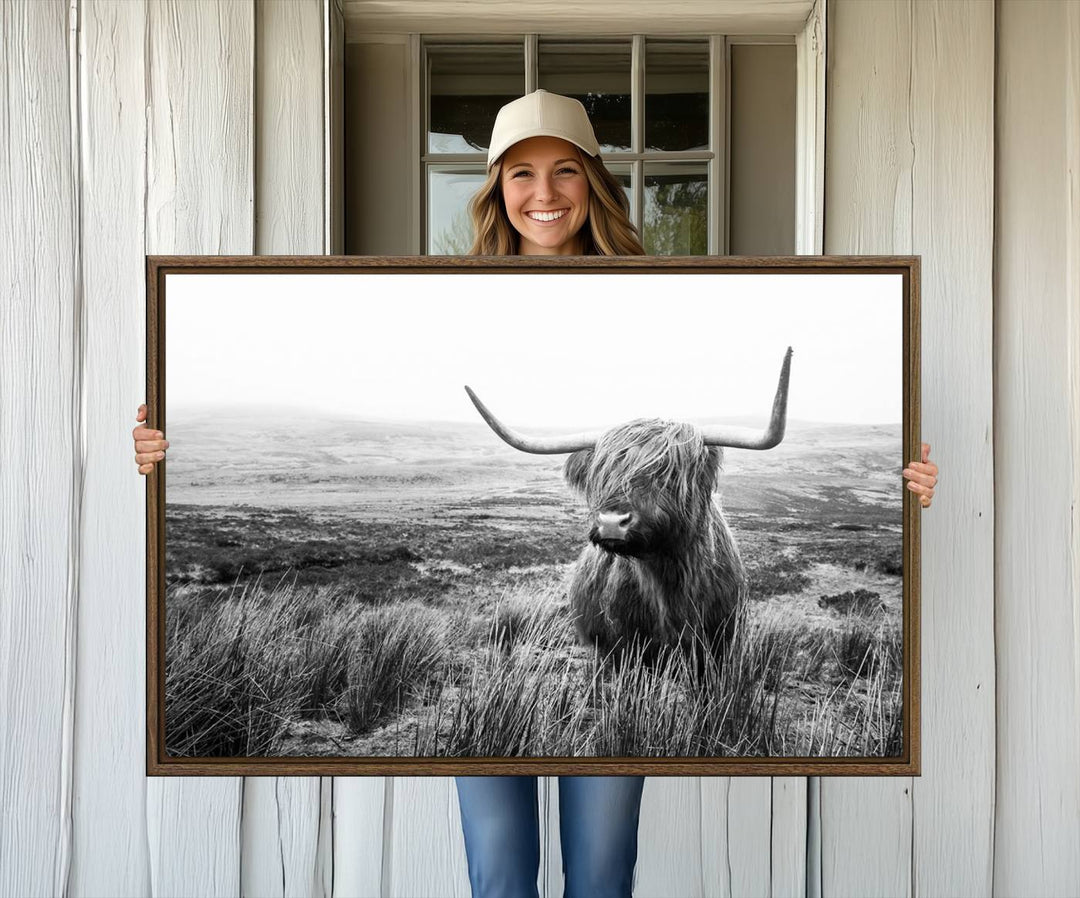 The Scottish Highland Cow black and white canvas print adds rustic farmhouse charm to any wall.