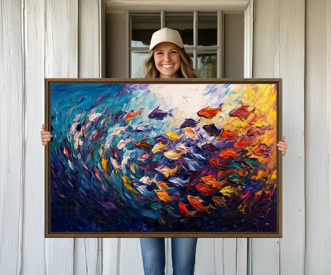 The Vibrant Abstract Fish Swarm Art features a colorful 3-piece canvas that adds a pop of color.