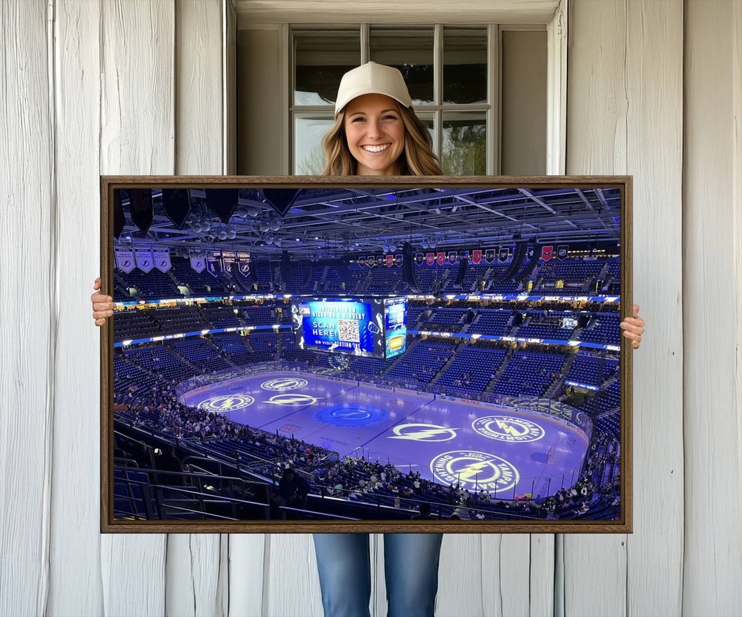 The wall art canvas print at Amalie Arena features team logos on ice, encapsulating the vibrant atmosphere of an NHL hockey stadium.