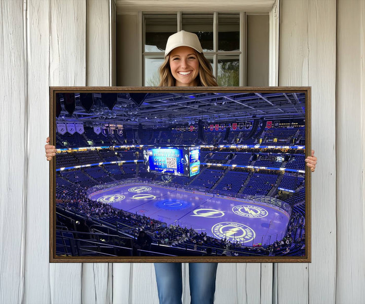 The wall art canvas print at Amalie Arena features team logos on ice, encapsulating the vibrant atmosphere of an NHL hockey stadium.