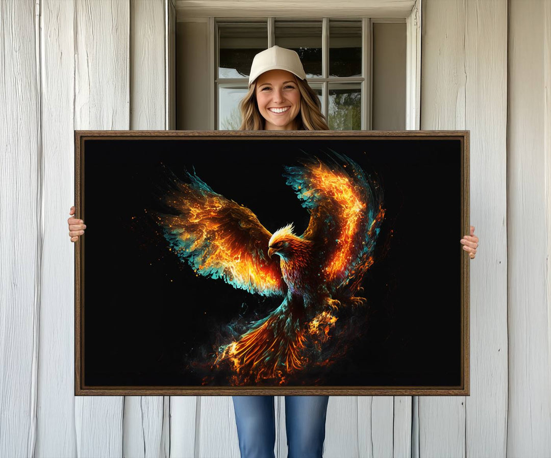 The Fiery Phoenix Canvas Print, showcasing a majestic bird with fiery wings against a black background, makes for the perfect bold decor in your living room.