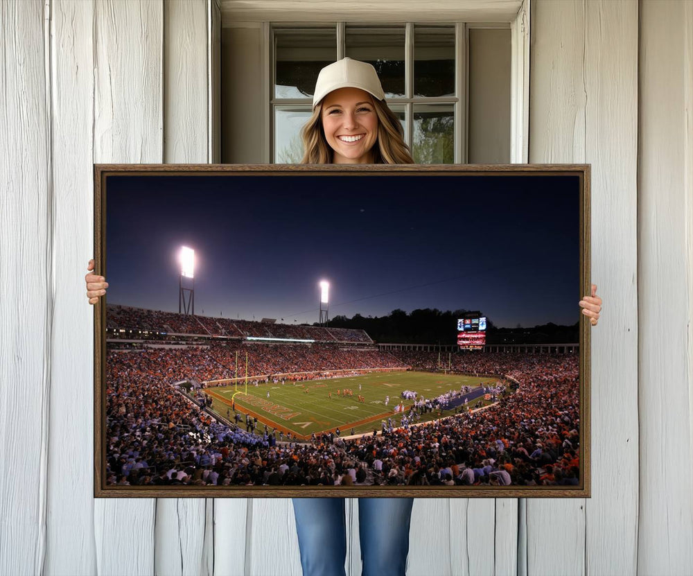 A nighttime game at Scott Stadium, floodlit—a scene from the Virginia Cavaliers Football art print.