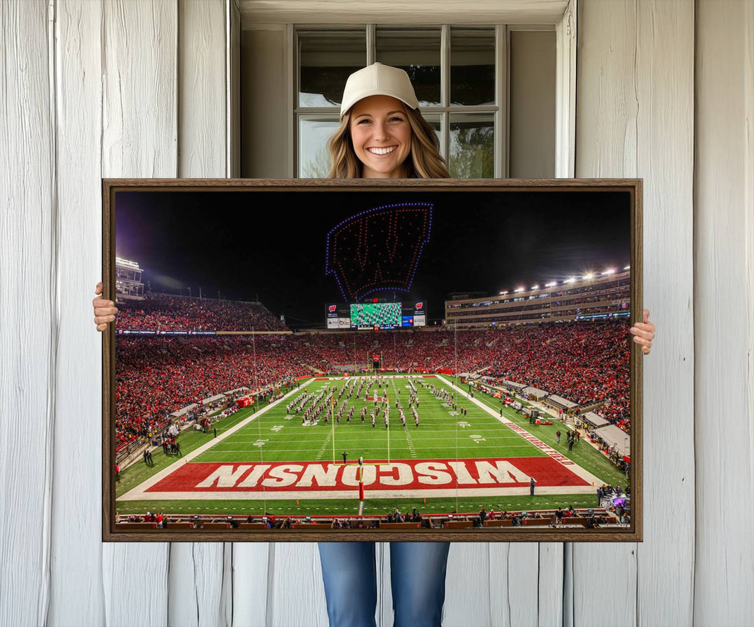 A premium canvas print captures a vibrant scene of Camp Randall Stadium featuring a lively football game with cheering fans and the energetic movements of the band.