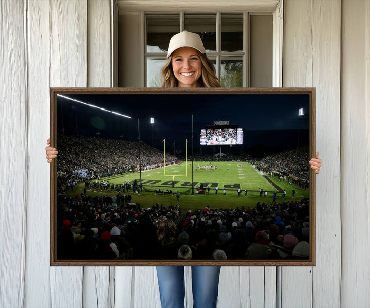 A Purdue Boilermakers canvas print beautifully showcases Ross–Ade Stadium in West Lafayette, vibrant with fans and a large screen display.