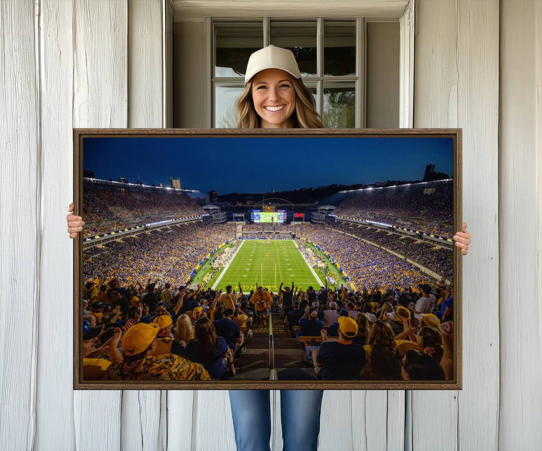 A Pittsburgh Panthers Acrisure Stadium canvas print captures the thrill of a packed stadium under lights and fans cheering.