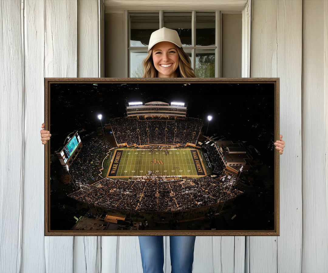 Canvas wall art displays an aerial view of Wake Forest Demon Deacons stadium at night.