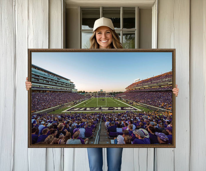 Sunset view of fans in purple at Bill Snyder Family Stadium, captured in a stunning gallery wall art canvas, perfect for a modern living room or office.