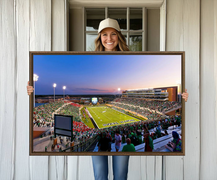 The canvas features Denton DATCU Stadium, OZEKI FIELD, illuminated under the lights and vibrant with fans supporting the University of North Texas.