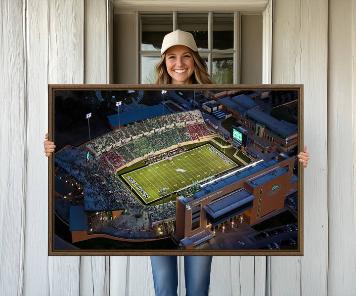 Night aerial view of fans at UNT Mean Green game captured on premium DATCU Stadium canvas wall art print.