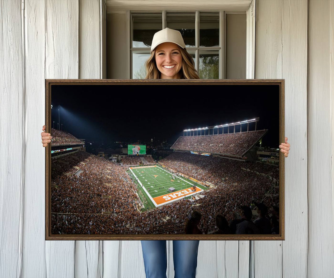 A football game at a packed stadium is captured on the University of Texas Longhorns Stadium Canvas Print.