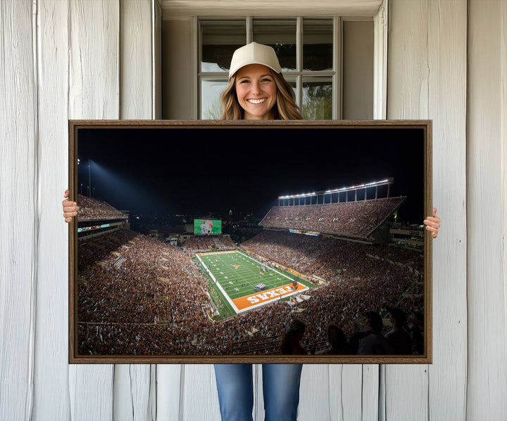 A football game at a packed stadium is captured on the University of Texas Longhorns Stadium Canvas Print.