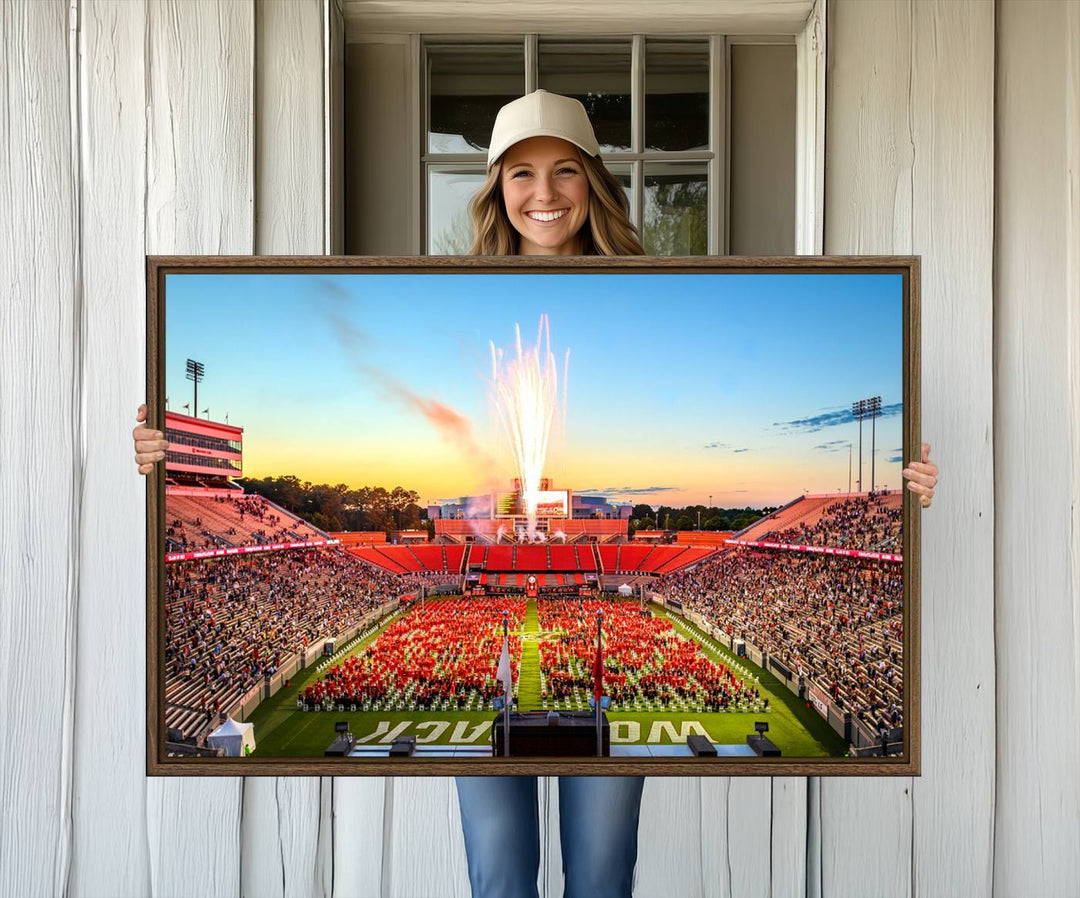 A vibrant North Carolina State University Wolfpack print, capturing a people-filled stadium, fireworks, and a sunset—perfect for your living room wall.