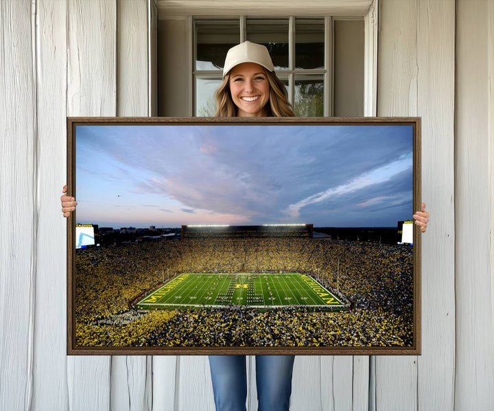 Gallery-quality canvas print of Michigan Stadium at sunset.