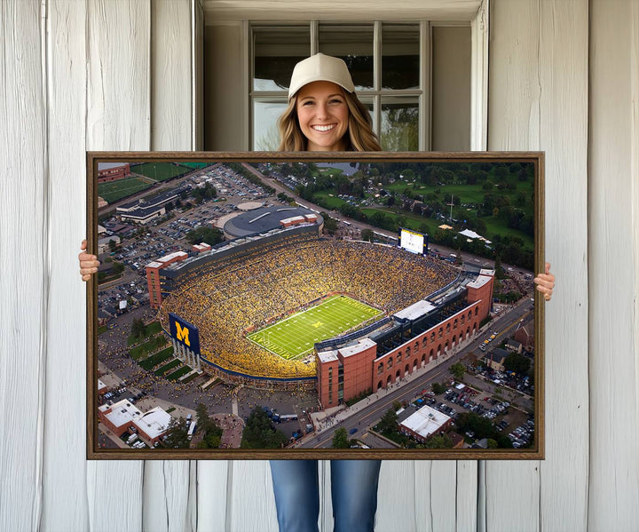 Canvas print featuring an aerial view of Ann Arbor Michigan Stadium filled with Wolverines fans.