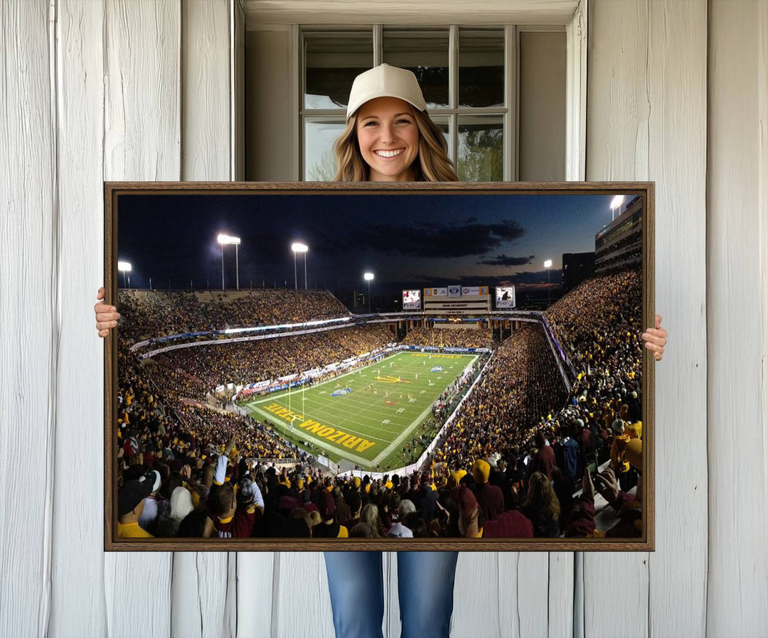 A room featuring an ASU Sun Devils Football Team Print, capturing fans at Phoenix Mountain America Stadium at dusk.