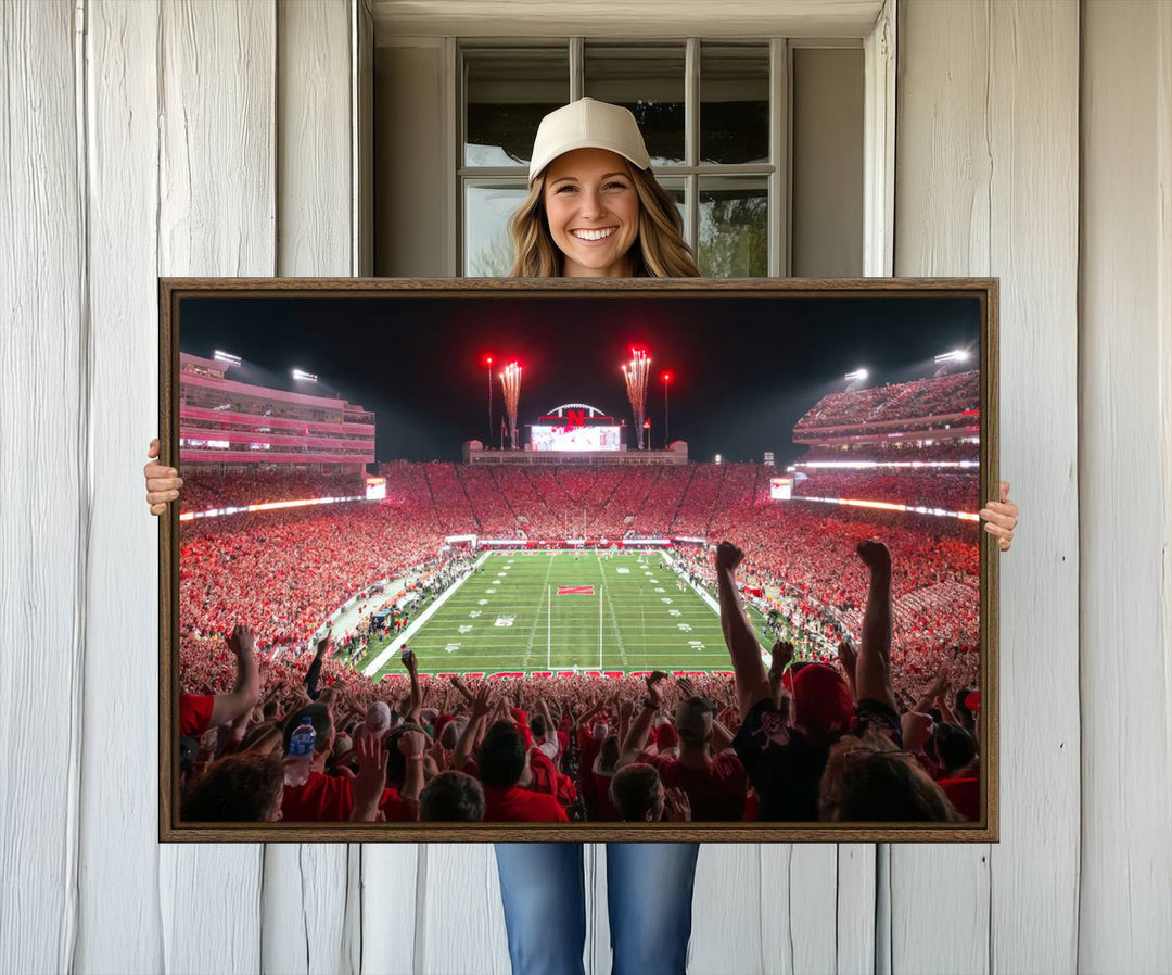 A vibrant canvas print of the Lincoln Memorial Stadium at night with fireworks, featuring the University of Nebraska Cornhuskers Football.