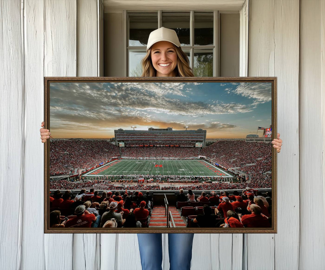 This stunning canvas wall art print features a packed Lincoln Memorial Stadium with the University of Nebraska Cornhuskers at sunset.