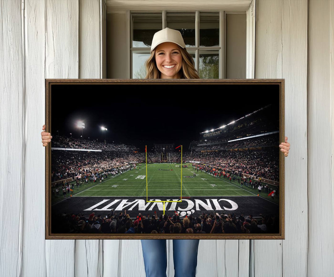 Interior view featuring a Cincinnati Bearcats football canvas of Nippert Stadium.