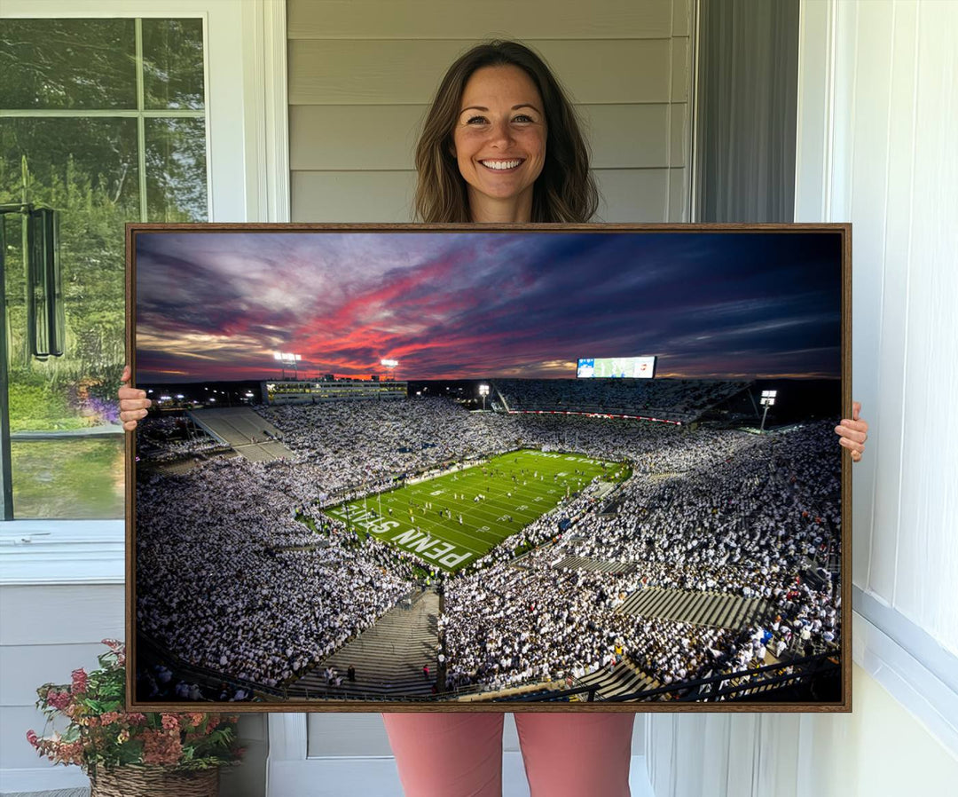 A sunset print on a canvas wall art piece captures the scene of white-clad fans at Beaver Stadium for the Nittany Lions game.