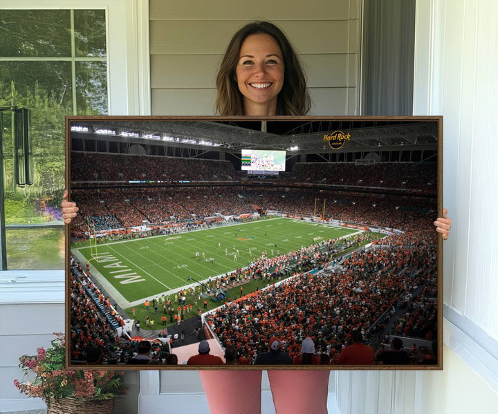 Aerial view of a Miami Hurricanes game at Hard Rock Stadium captured on canvas print, showcasing the teams on the field and fans in the stands.