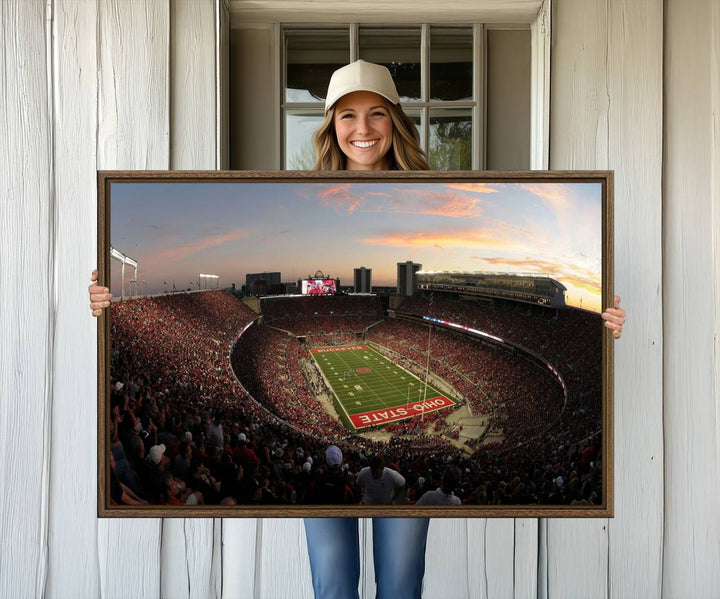 The canvas wall art captures a stunning stadium view of a sunset over Ohio State University Buckeyes football fans.