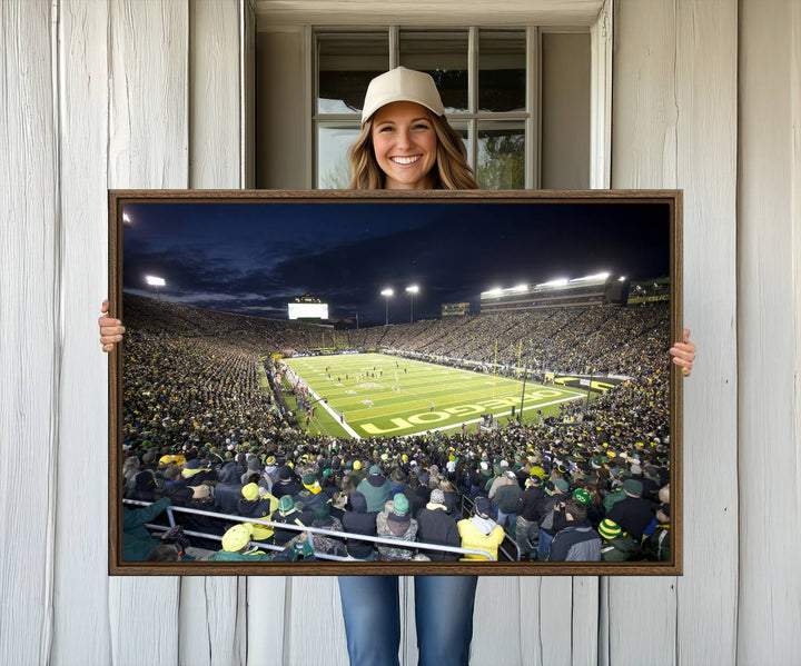 Under bright lights, a University of Oregon Ducks Canvas Print captures the excitement of fans packing Autzen Stadium for a night football game.