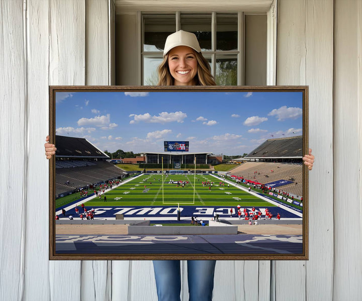 Rice Stadium print: This artwork features a football field with empty stands and a gallery-quality finish under a clear blue sky.